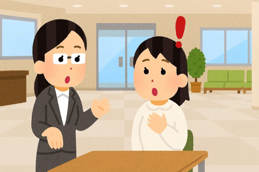 話を聞いて驚く女性